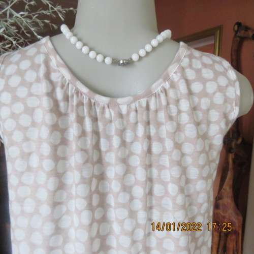 Cool ecru colour sleeveless top with white opaque dots.Size 32/8. Front cross overlay.As new