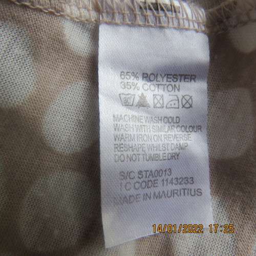 Cool ecru colour sleeveless top with white opaque dots.Size 32/8. Front cross overlay.As new
