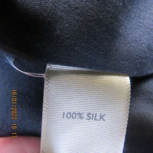 Amazing navy blue 100% silk skirt with wide stitched yoke and knife pleated skirt.Size 34. Lined.