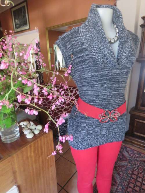 Stylish black/white mottled long acrylic knit sleeveless top.Foldover fireside collar.Size 36/12.