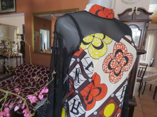 Ethnic look cream dress with bold autumn design.Black long sheer sleeves and yoke.Size 36 by ENVY.