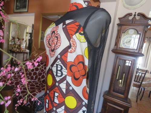 Ethnic look cream dress with bold autumn design.Black long sheer sleeves and yoke.Size 36 by ENVY.