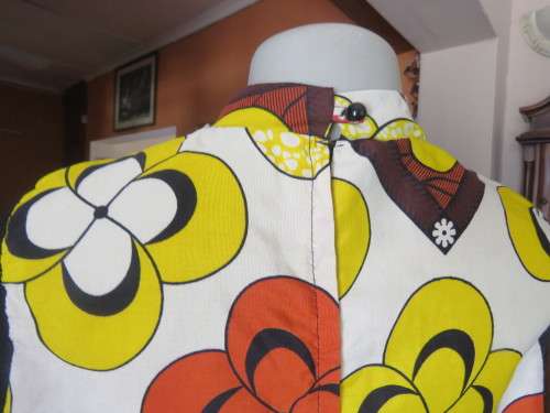 Ethnic look cream dress with bold autumn design.Black long sheer sleeves and yoke.Size 36 by ENVY.