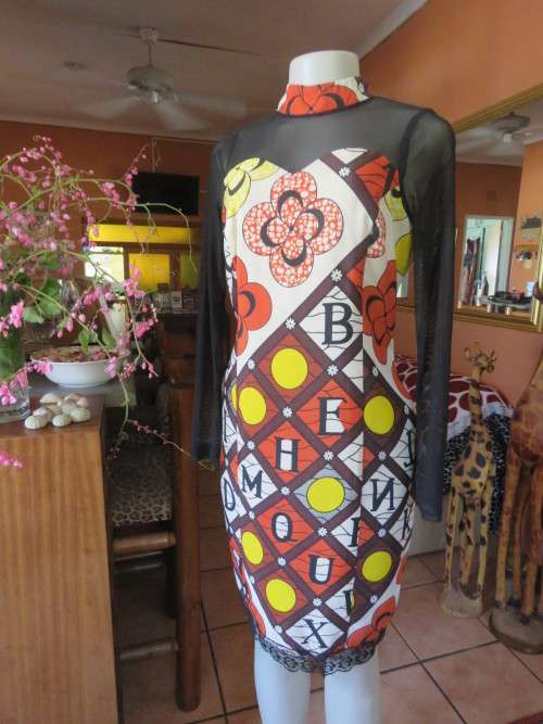 Ethnic look cream dress with bold autumn design.Black long sheer sleeves and yoke.Size 36 by ENVY.