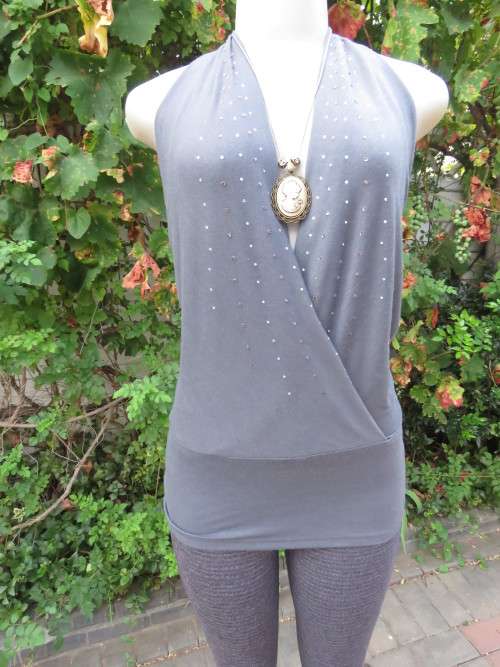 Sexy anchor grey halterneck top with embellished fronts.Waterfall style back.By TRU Glamour.Size 36