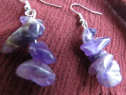 Pair of light purple small amethyst stone piercing earrings. Made up of a few stones each.New item