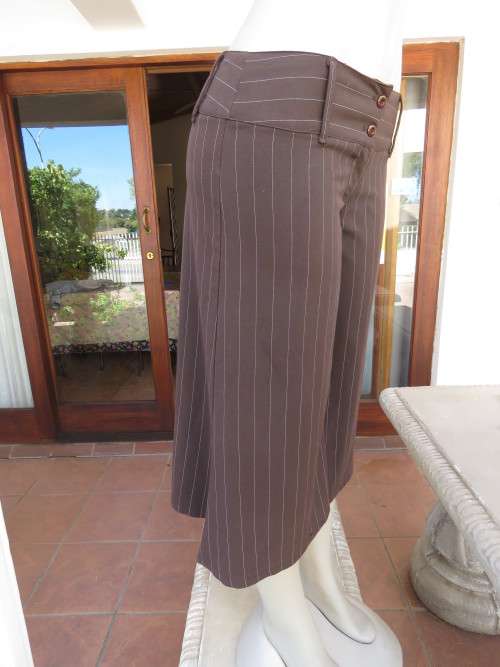Choc brown wide legged skirt pants calf length with thin white vertical stripes.Zip on front.Size 32