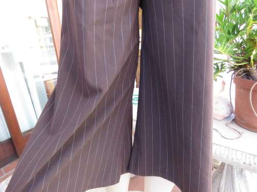 Choc brown wide legged skirt pants calf length with thin white vertical stripes.Zip on front.Size 32