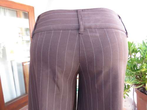 Choc brown wide legged skirt pants calf length with thin white vertical stripes.Zip on front.Size 32