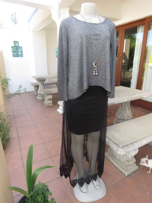 Glitter long sleeve slip over top in polyester,viscose,metalic silver.Size 36 to 38 by H+M As new