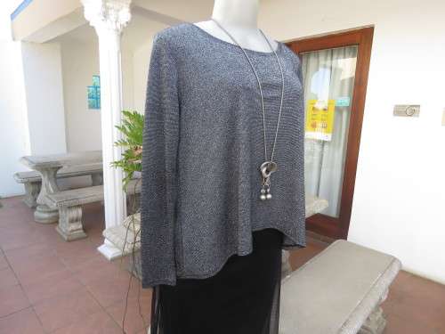 Glitter long sleeve slip over top in polyester,viscose,metalic silver.Size 36 to 38 by H+M As new