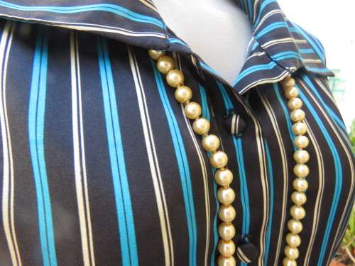 Fabulous long sleeve striped top in brown,cream and tuequoise.Size 48/24 by JUDY`S PRIDE.Button down