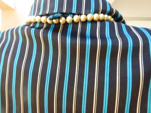 Fabulous long sleeve striped top in brown,cream and tuequoise.Size 48/24 by JUDY`S PRIDE.Button down