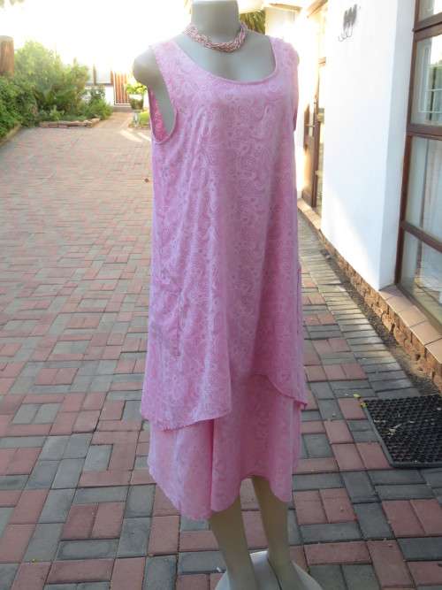 As new ALABASTER pink dress in 2 shades.Loose hanging in 2 layers/lengths.Size 38/14.