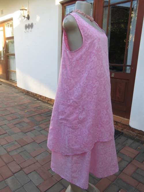 As new ALABASTER pink dress in 2 shades.Loose hanging in 2 layers/lengths.Size 38/14.