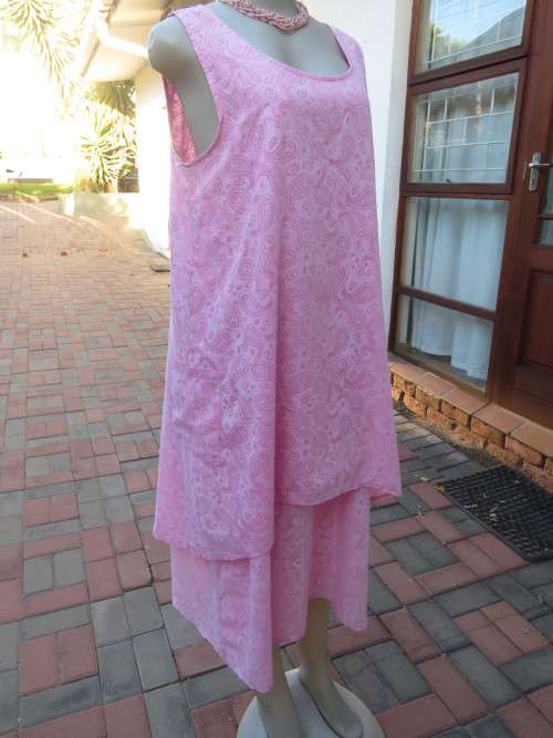 As new ALABASTER pink dress in 2 shades.Loose hanging in 2 layers/lengths.Size 38/14.