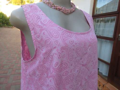 As new ALABASTER pink dress in 2 shades.Loose hanging in 2 layers/lengths.Size 38/14.