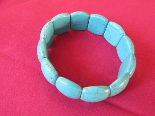 Lovely turquoise stretch bangle with light brown veins.Bought in Thailand on island.Used once.