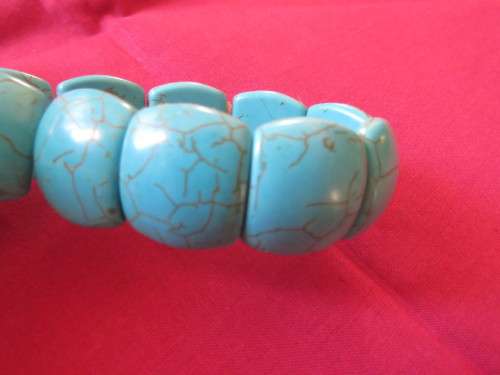 Lovely turquoise stretch bangle with light brown veins.Bought in Thailand on island.Used once.
