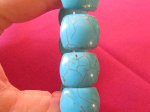 Lovely turquoise stretch bangle with light brown veins.Bought in Thailand on island.Used once.