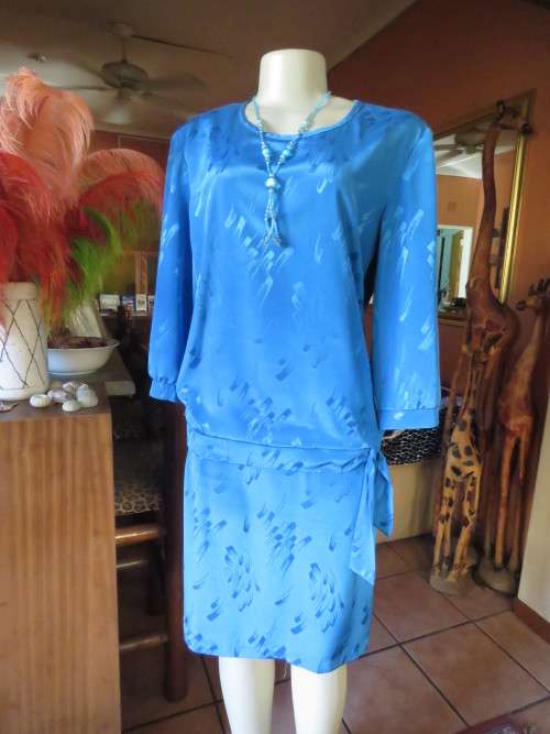 Chic,azure blue vintage dropped waist slip over dress in silky, shiny polyester.Size 40/16 by ALVECO
