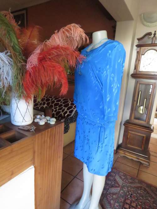 Chic,azure blue vintage dropped waist slip over dress in silky, shiny polyester.Size 40/16 by ALVECO