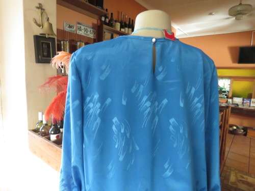 Chic,azure blue vintage dropped waist slip over dress in silky, shiny polyester.Size 40/16 by ALVECO