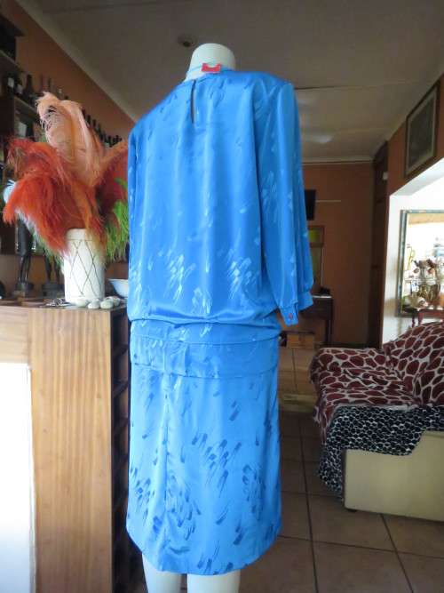 Chic,azure blue vintage dropped waist slip over dress in silky, shiny polyester.Size 40/16 by ALVECO