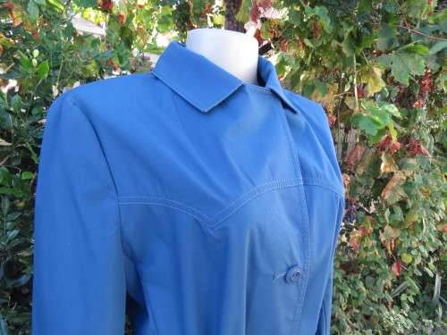 As new original RUDCO light weight steel blue chesterfield button down coat size 38/14.With belt.