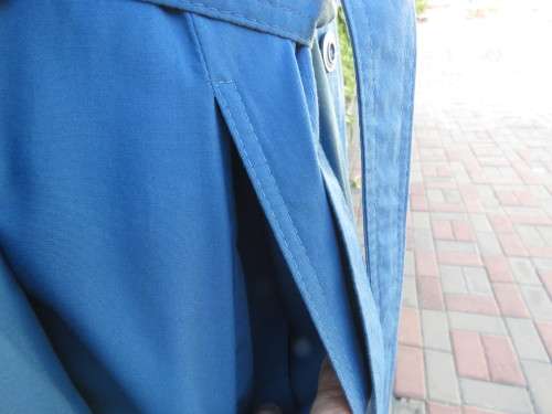 As new original RUDCO light weight steel blue chesterfield button down coat size 38/14.With belt.