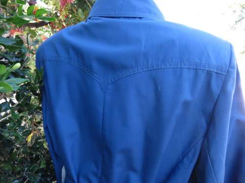 As new original RUDCO light weight steel blue chesterfield button down coat size 38/14.With belt.