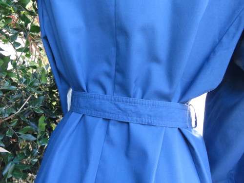 As new original RUDCO light weight steel blue chesterfield button down coat size 38/14.With belt.