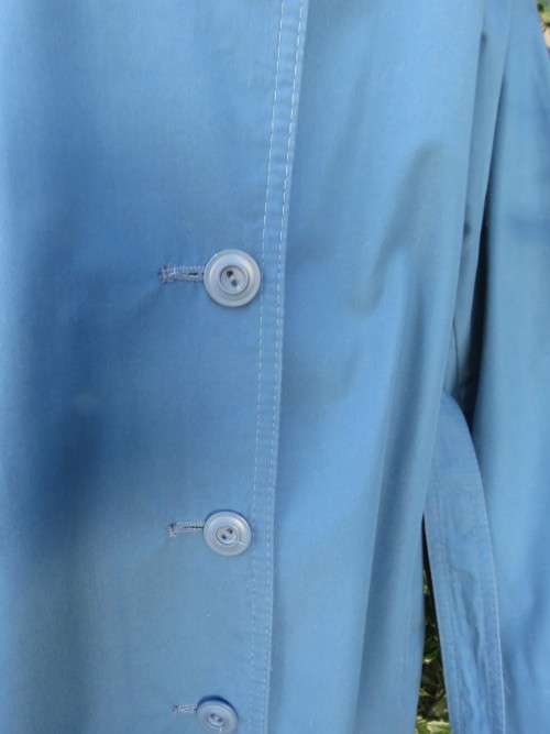 As new original RUDCO light weight steel blue chesterfield button down coat size 38/14.With belt.
