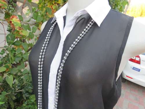 Sweet black/white sheer polyester button down top with white shirt collar.Longer back.Size 32 to 34