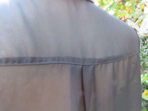 Sweet black/white sheer polyester button down top with white shirt collar.Longer back.Size 32 to 34