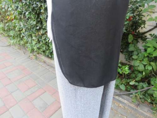 Sweet black/white sheer polyester button down top with white shirt collar.Longer back.Size 32 to 34