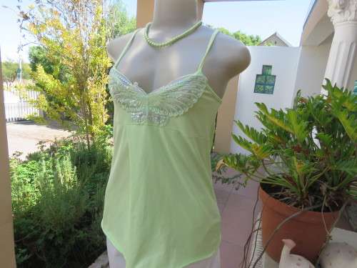 Sweet lime colour strappy top in stretch cotton with sequin butterfly on front.Size 32/8. New cond.