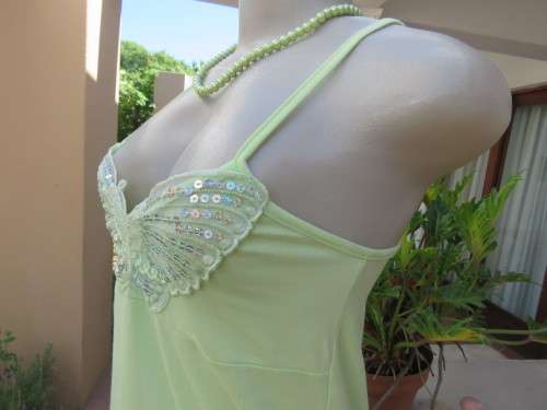 Sweet lime colour strappy top in stretch cotton with sequin butterfly on front.Size 32/8. New cond.