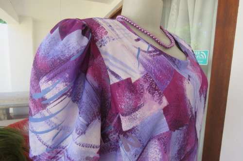 Vintage purple/pink geometric patterned dress by Nuvelle by ROSECRAFT size 44/20.Pleated bottom.