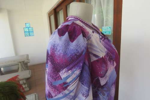 Vintage purple/pink geometric patterned dress by Nuvelle by ROSECRAFT size 44/20.Pleated bottom.