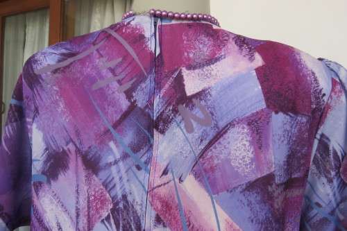 Vintage purple/pink geometric patterned dress by Nuvelle by ROSECRAFT size 44/20.Pleated bottom.