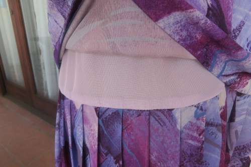 Vintage purple/pink geometric patterned dress by Nuvelle by ROSECRAFT size 44/20.Pleated bottom.