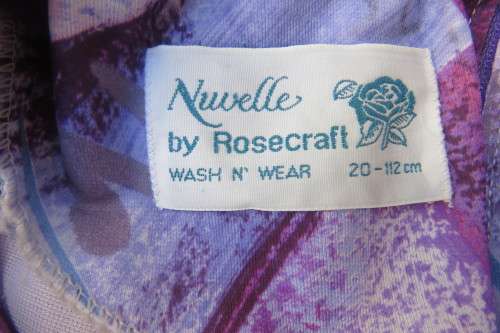 Vintage purple/pink geometric patterned dress by Nuvelle by ROSECRAFT size 44/20.Pleated bottom.