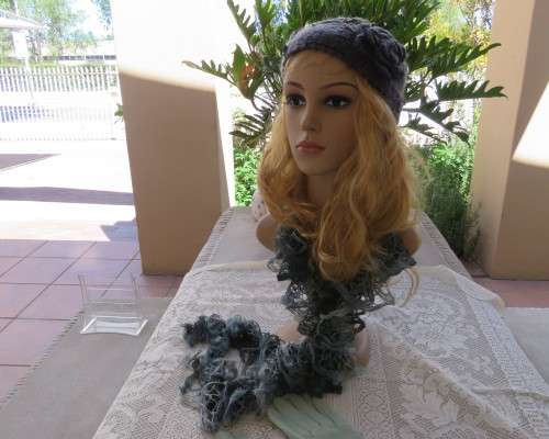 Chic bluegrey knitted hairband 12cm wide with knitted flower and green leaves on sides.As new.