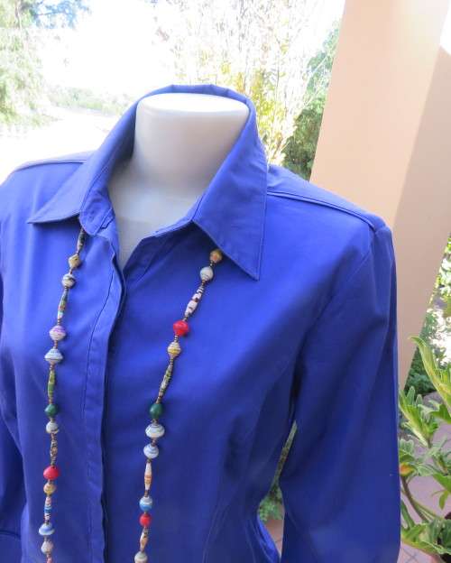 High quality long sleeve royal blue top by STUDIO W size 38/14.Hidden button down and shirt collar.