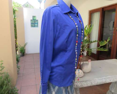 High quality long sleeve royal blue top by STUDIO W size 38/14.Hidden button down and shirt collar.