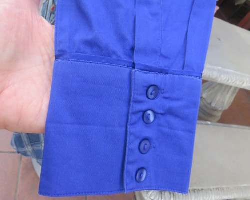 High quality long sleeve royal blue top by STUDIO W size 38/14.Hidden button down and shirt collar.