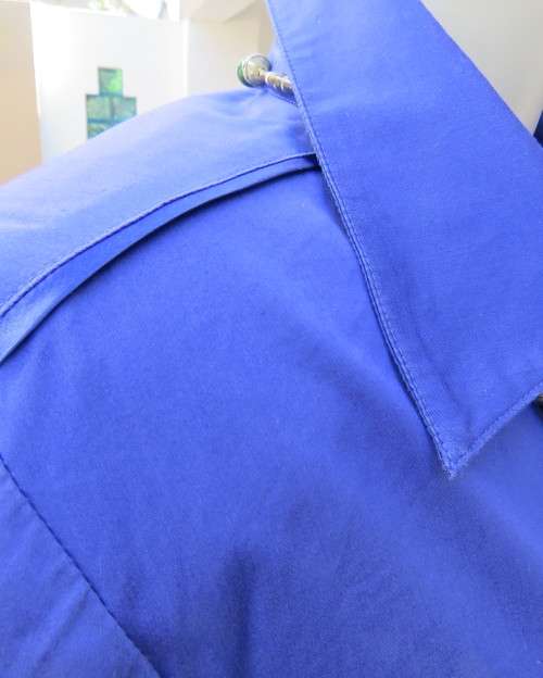 High quality long sleeve royal blue top by STUDIO W size 38/14.Hidden button down and shirt collar.