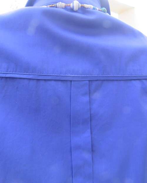 High quality long sleeve royal blue top by STUDIO W size 38/14.Hidden button down and shirt collar.