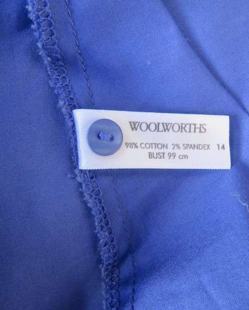 High quality long sleeve royal blue top by STUDIO W size 38/14.Hidden button down and shirt collar.